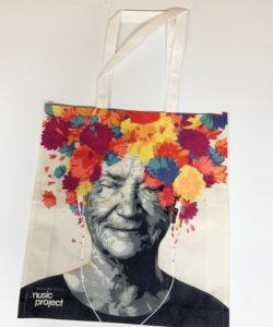 Colourful tote bag featuring the iconic Alzheimer Society Music Project artwork.